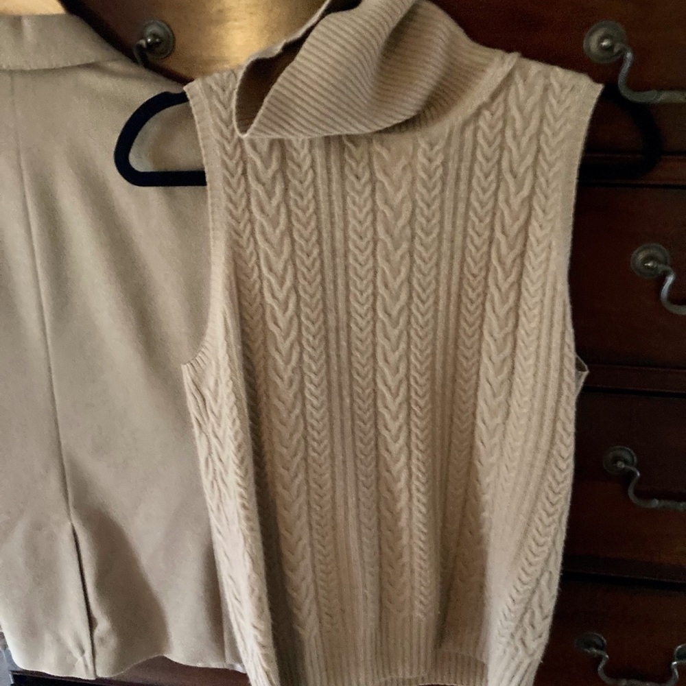 Cashmere sleeveless cable turtleneck.